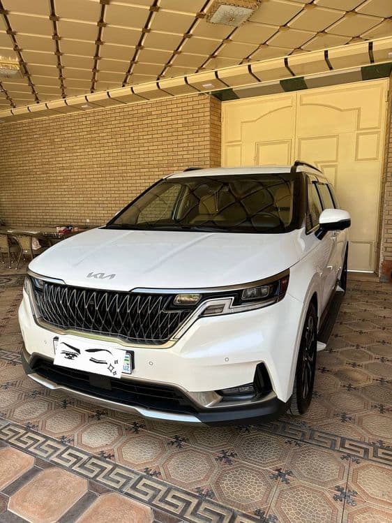 Kia Carnival 4 белый — 1