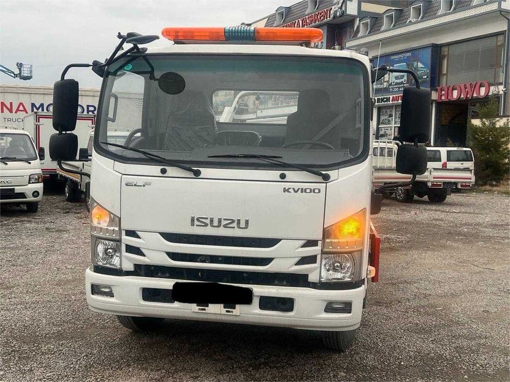 ISUZU ELF KV100 Эвакуатор — 1