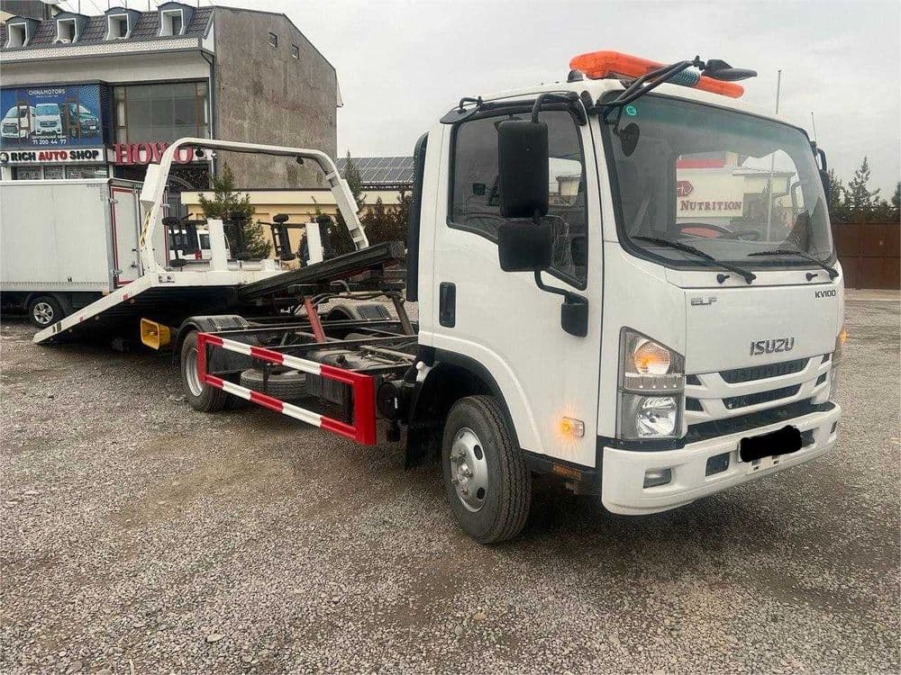 ISUZU ELF KV100 Эвакуатор — 2