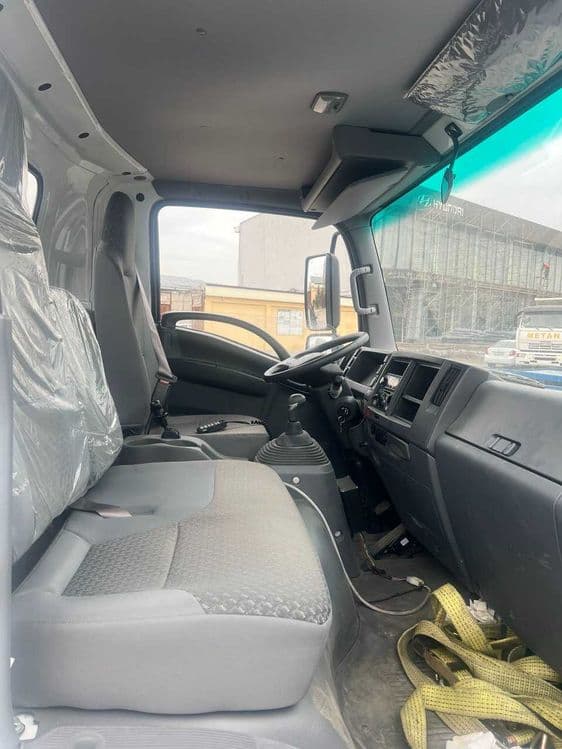 ISUZU ELF KV100 Эвакуатор — 6